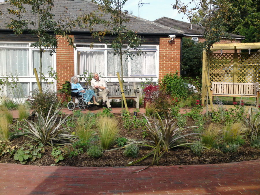 Resident and son enjoying the new Care home garden