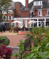 Partiallly sighted resident using the directional paving in new care home garden