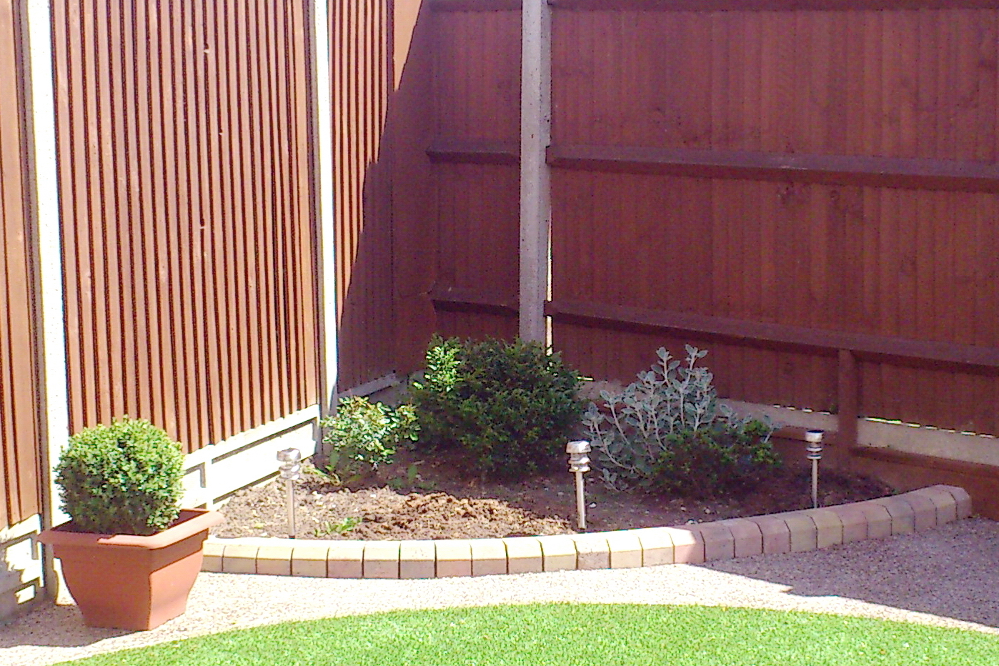 A tiny border of a garden in Northolt in need of colour and interest