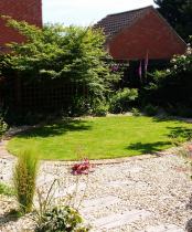 Small back garden with cottage planting